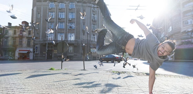 young man doing street dance, feeling happy and energetic.