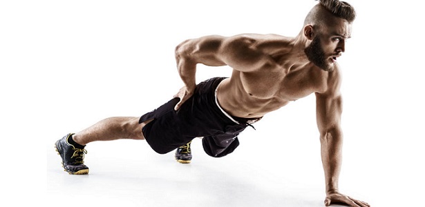 attractive man doing push-ups exercises from the floor on the left arm. photo muscular man isolated on white background. the strength and motivation